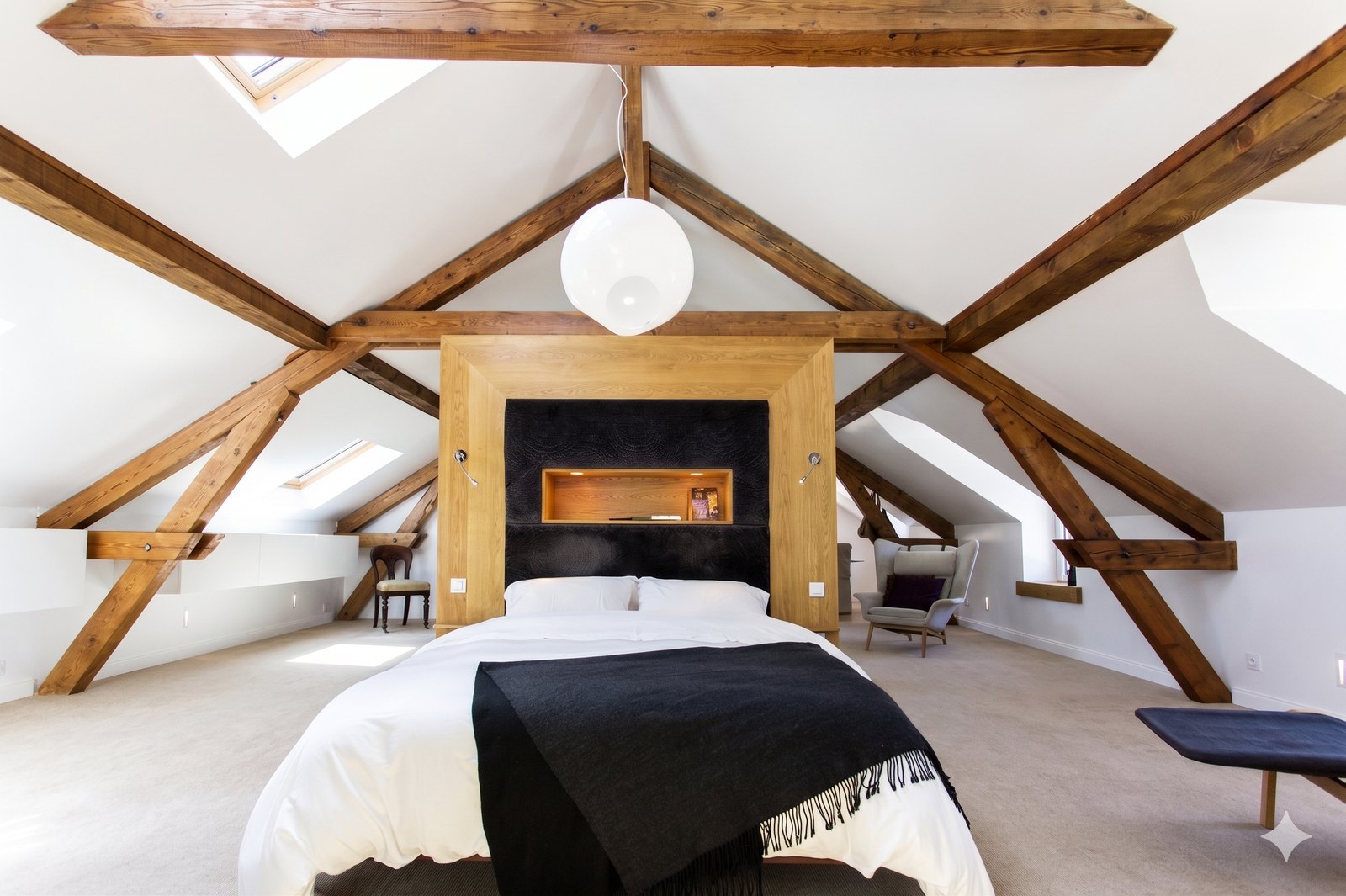 Lakehouse attic bedroom, Annecy, exposed timber trusses